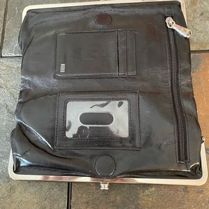 HOBO Wallet, black in color with silver hardware. 9” long and 5” tall.